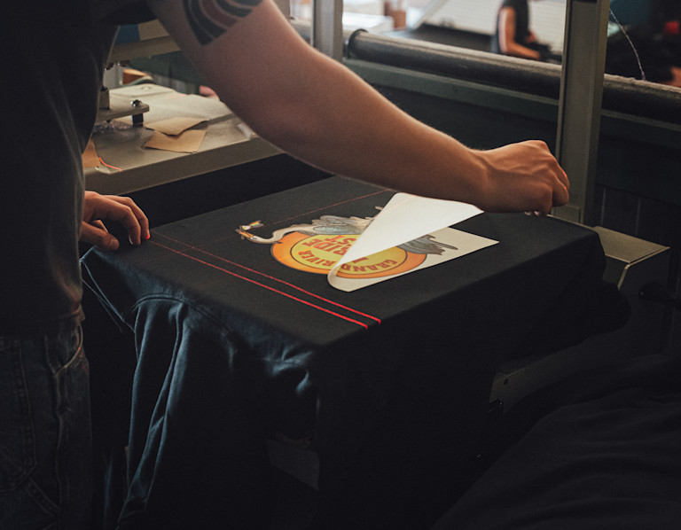 T-shirt being loaded on to platen