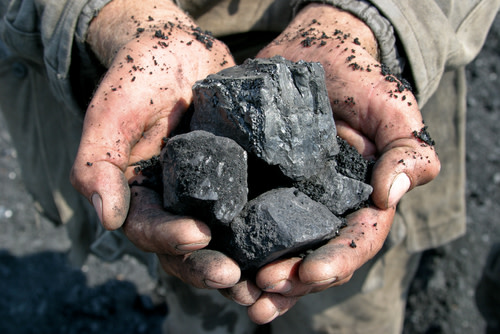 Holding Coal in Hands