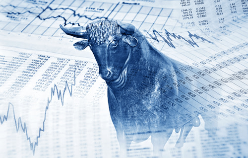 Financial documents, graphs, and a silver bull.