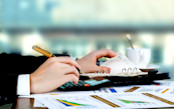 Man with calculator and papers