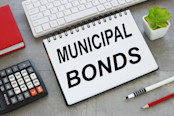 Municipal bonds notepad with text on white keyboard