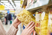 Pack of pasta in the hands of the buyer