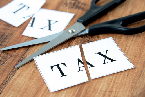 The word "Tax" on cut up pieces of paper