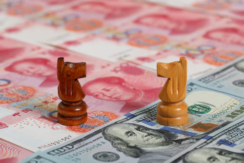 Chess Pieces on Yuan and Dollar