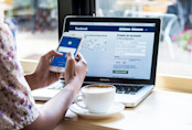 Woman on Facebook at Cafe