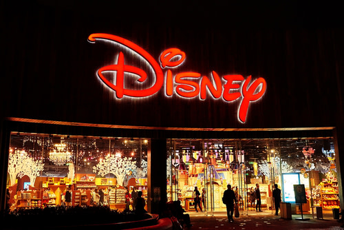 A large Disney sign over a store.