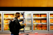 Man buying meat in a superstore