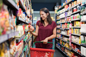 Woman Browsing Packaged Food Aisle