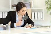 Suspicious woman looking at document