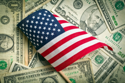 American flag and a U.S. dollar bill