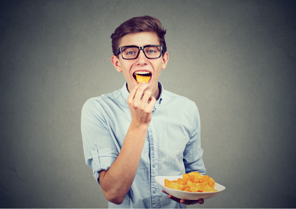 Man eating snacks
