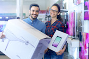 Couple buying electronic goods from a retail store