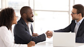 Happy clients with their advisors