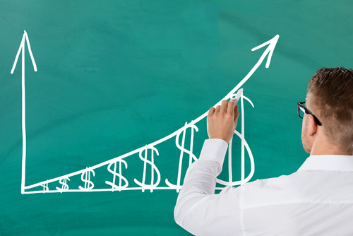 Businessman Illustrating Rising Inflation