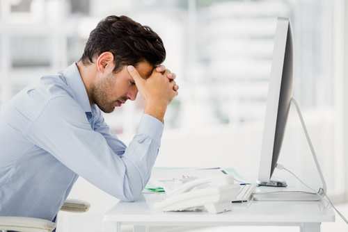 Worried Man at Desk