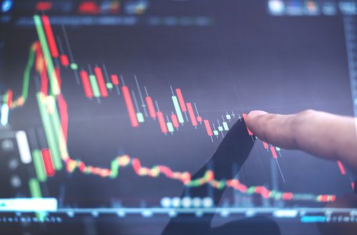Finger pointing to a graph