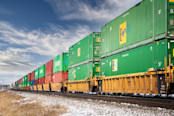 train carrying sea cans and cargo containers