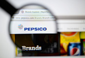 PepsiCo logo looked through a magnifying glass