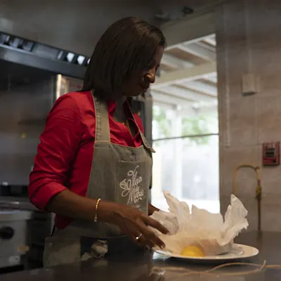 Korra cooking inside the Fleur de Marie kitchen.
