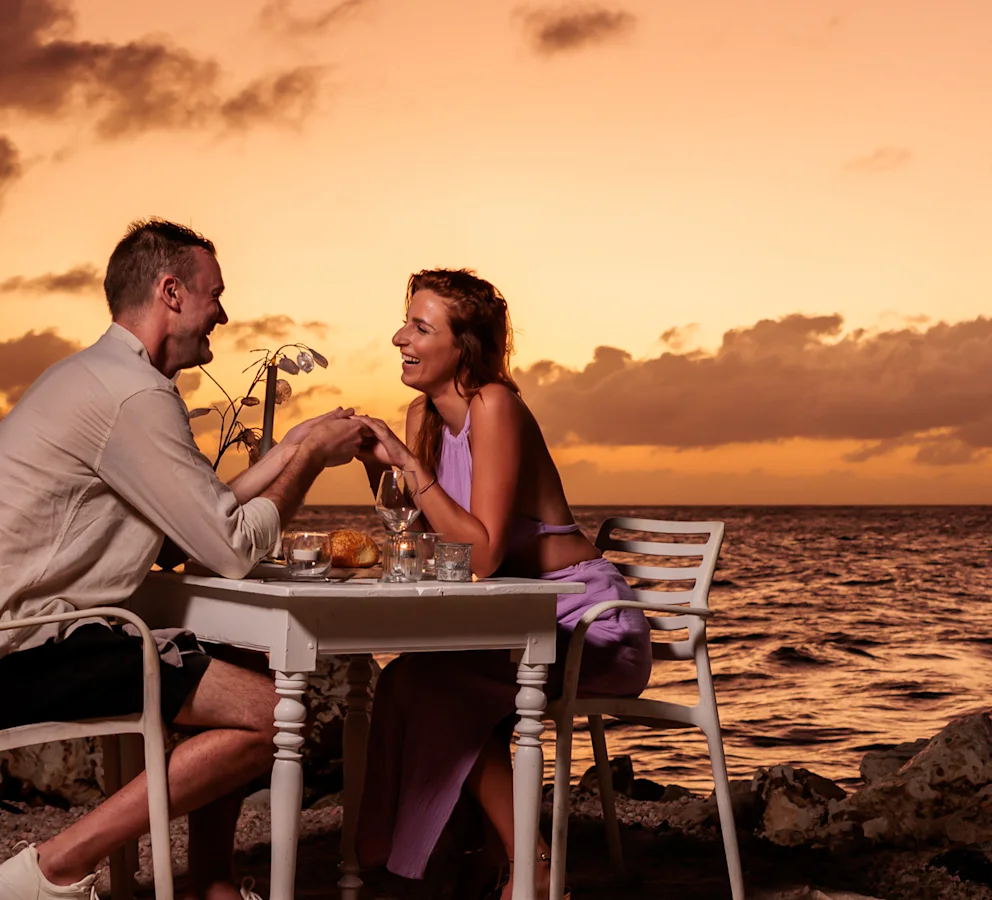 Couple on beach during sunset