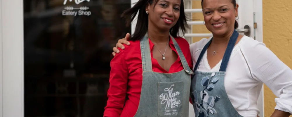 Angela standing outside her restaurant