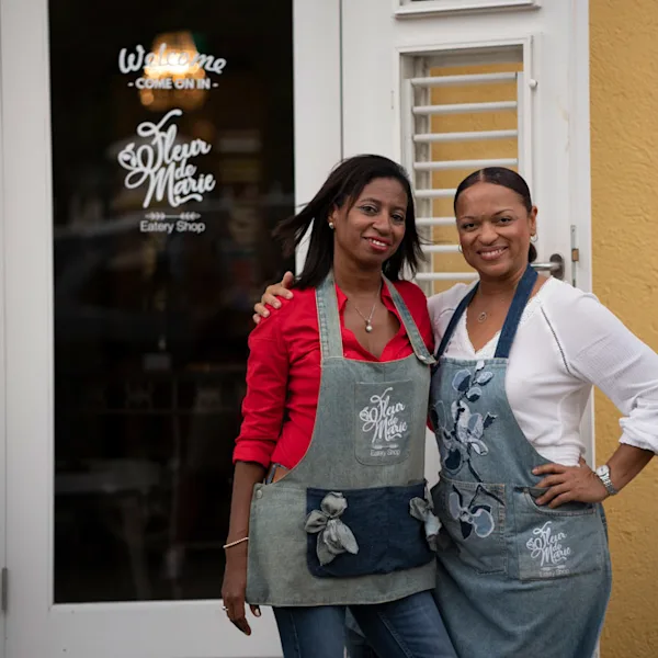 Angela standing outside her restaurant