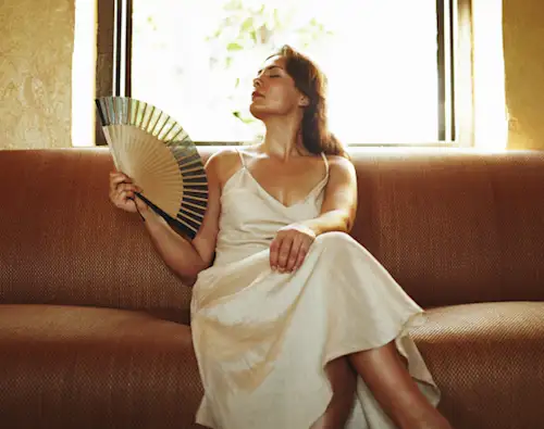 Woman fanning herself