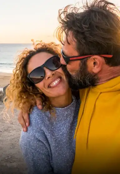 Couple hugging and lady smiling