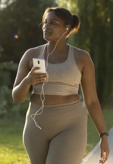 Lady walking with headphones