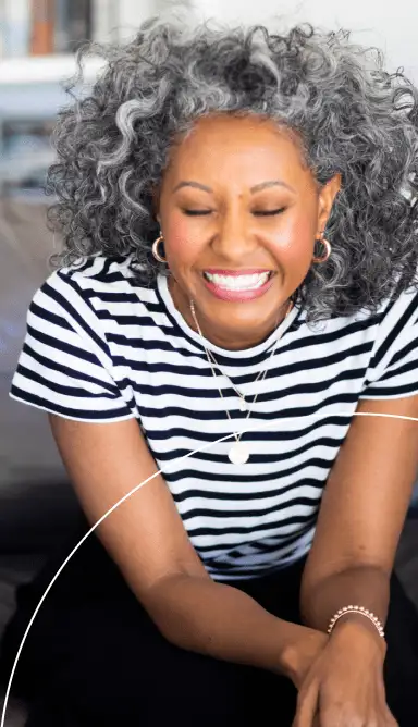 Lady smiling in striped shirt