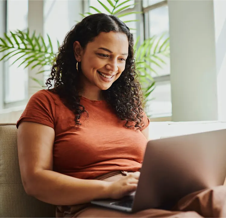 Woman smiling at laptop