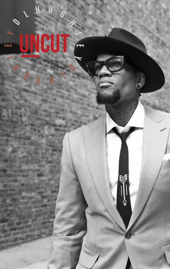 dl uncut, dl hughley, king of comedy, in a suit with a hat