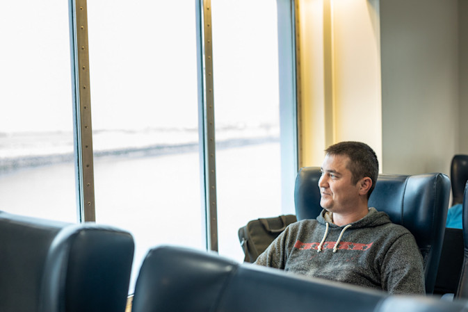 A DFDS Freight and Logistics driver sitting inside a vessel