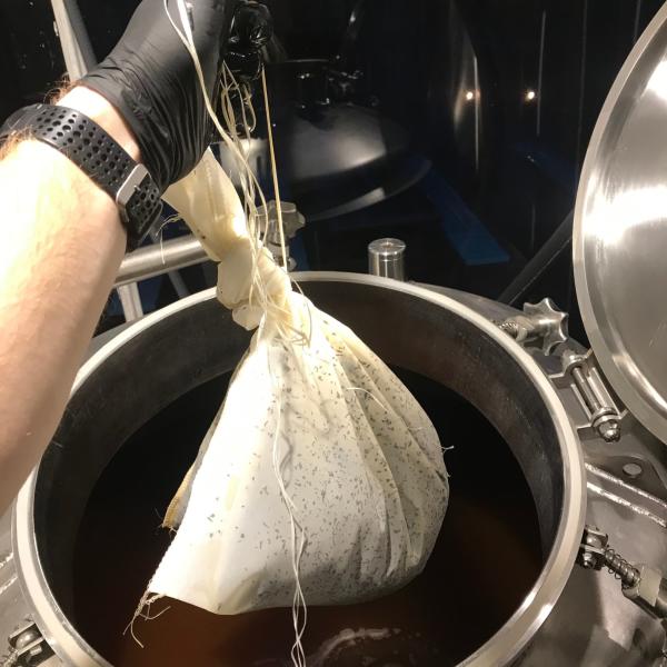 Adding a giant tea bag to a beer