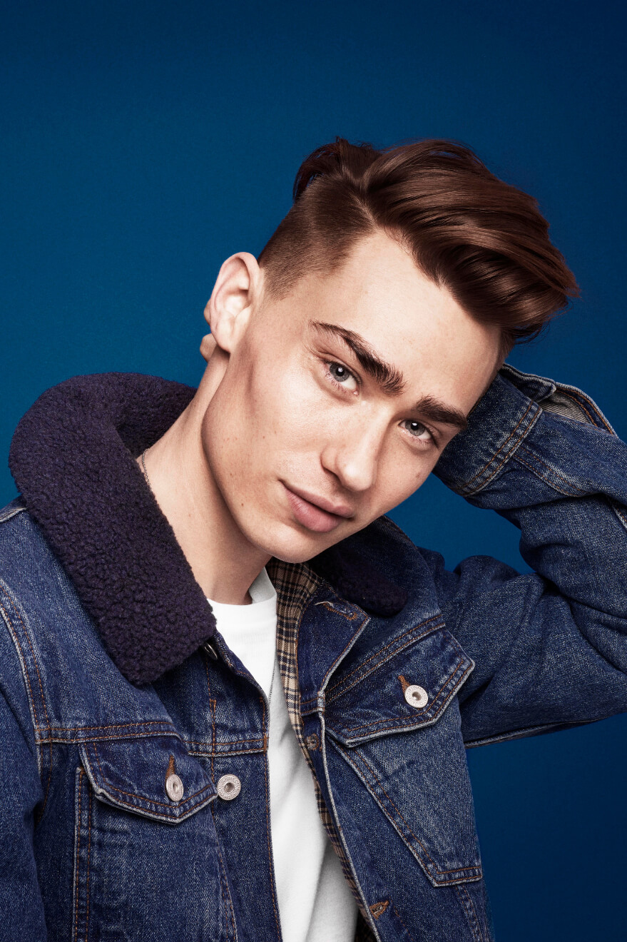 Man touching back of his head.