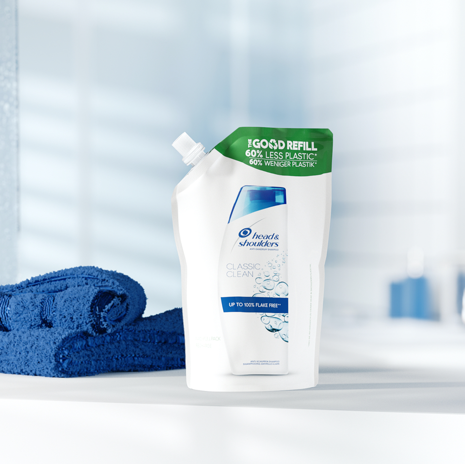 Head&Shoulders refill pack next to the towel on the bathroom background.