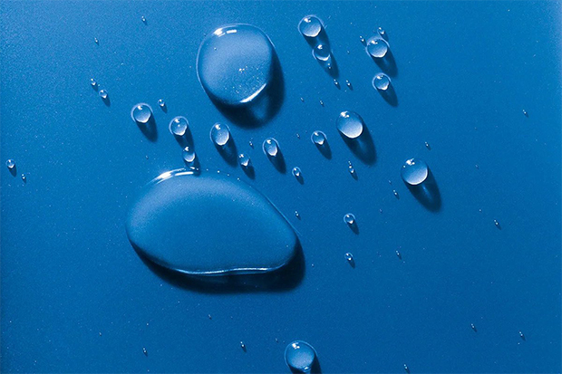Water drops on the indigo-blue surface.
