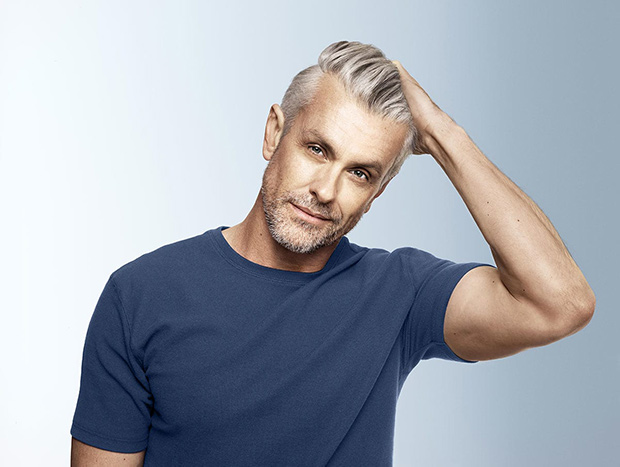 Older man with long gray quiff