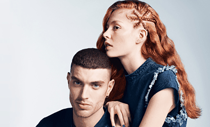 Man and woman with her chin rested on his head.