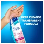 a splash of Deep Cleanse Gentle Purification H&S Shampoo poured into the hand, with the claim "deep cleanse transparent formula" written next to the bottle