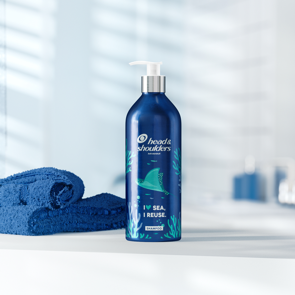 Head&Shoulders aluminium bottle next to the towel on the bathroom background.