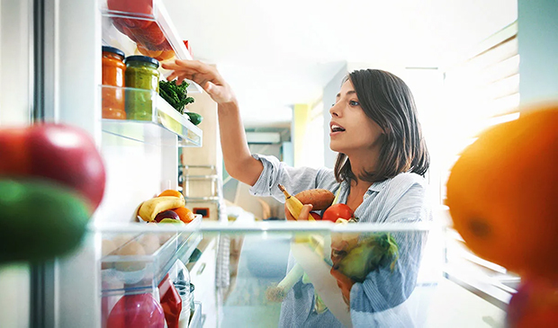 Woman looking at food on shelf