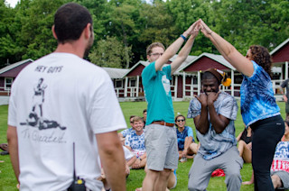 Team members playing a game at camp