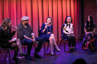 women speaking on a panel