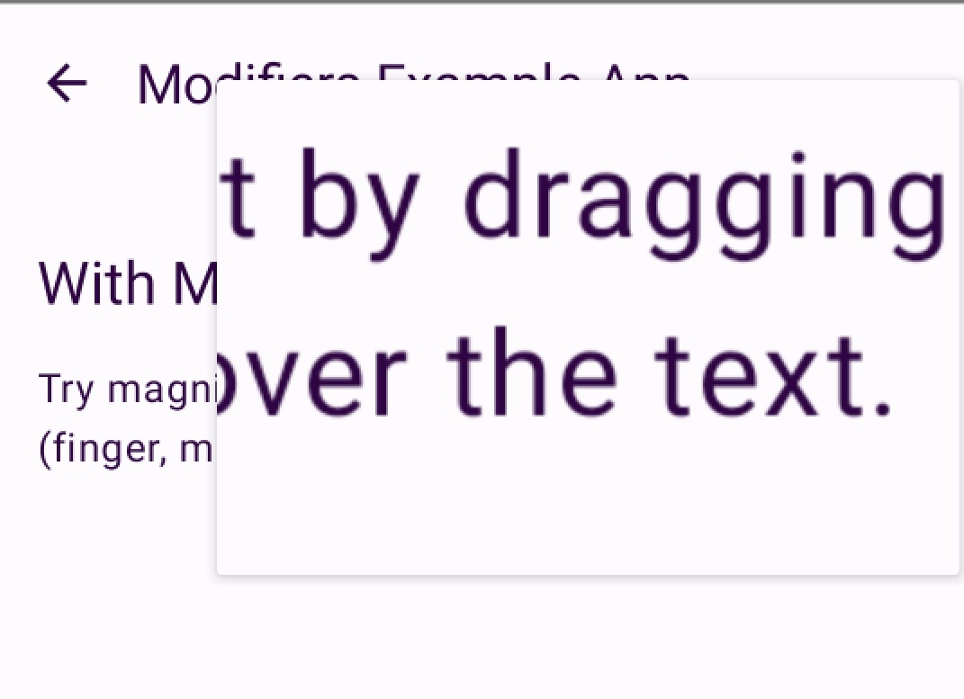 A screen where the magnifier covers part of the text, and the visible text is "t by dragging" and "over the text."