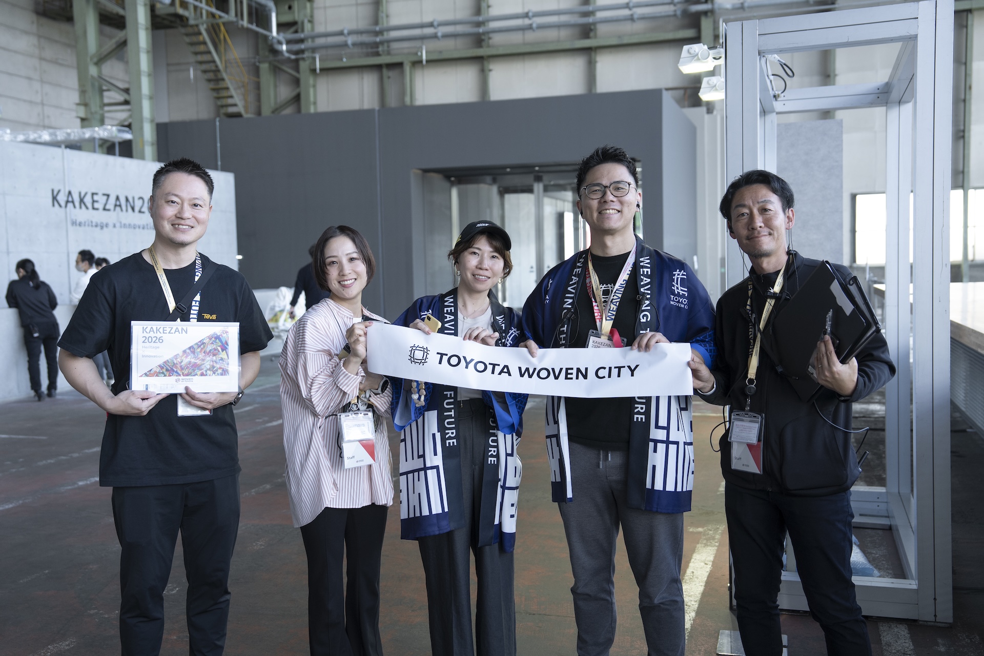 Organizing members of KAKEZAN 2026 smile for a team photo.