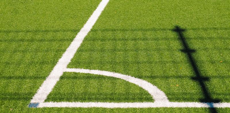 grass playing field with white lines