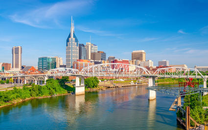 City skyscrapers sit across the river in Nashville, one of the best spring break ideas for families.