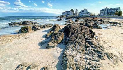 Rock formations break up the sand at Mother’s Beach, one of the best beaches for kids on the East Coast.