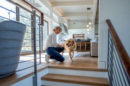 A Pacaso owner with her dog in a large and modern vacation home